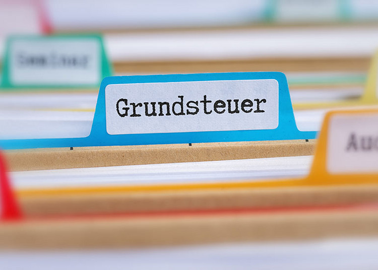 Ausschnitt auf Aktenregister. Auf einem Reiter ist „Grundsteuer“ zu lesen.