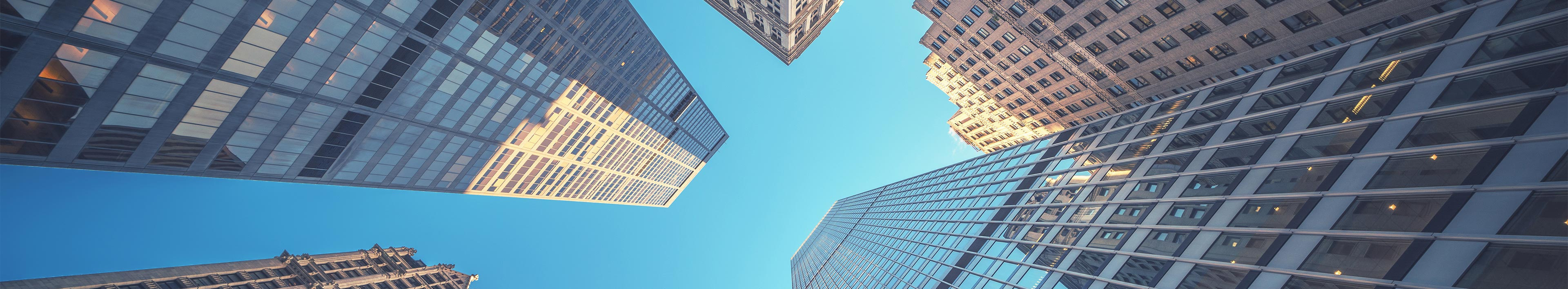 View through skyscrapers into the sky.